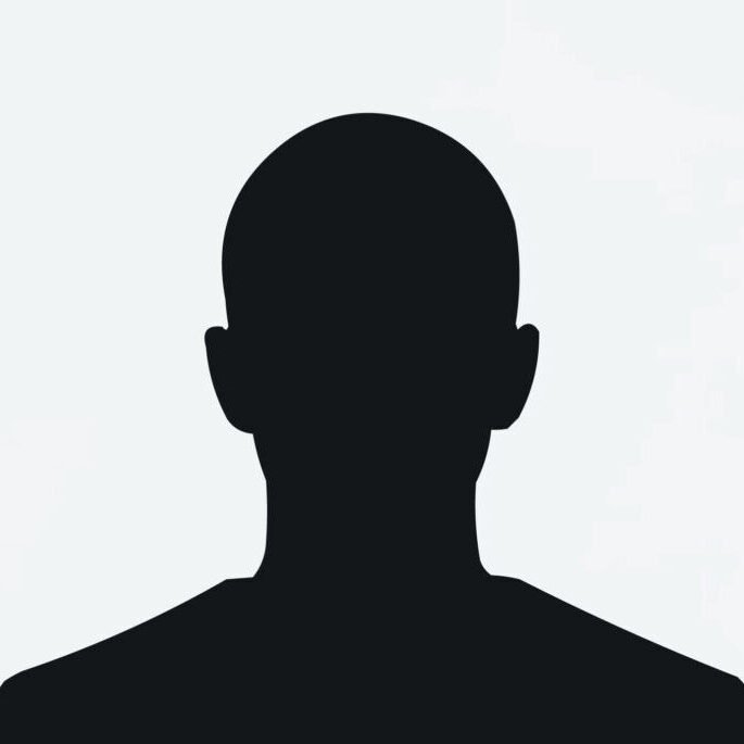 Silhouette of a man standing against a white background.